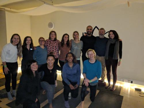 The crowd at Calm is all smiles following a meditation exploring emotional walls, led by Andrew Johnson (second from right).